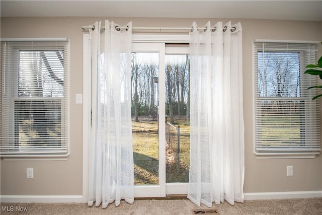 entryway featuring carpet flooring