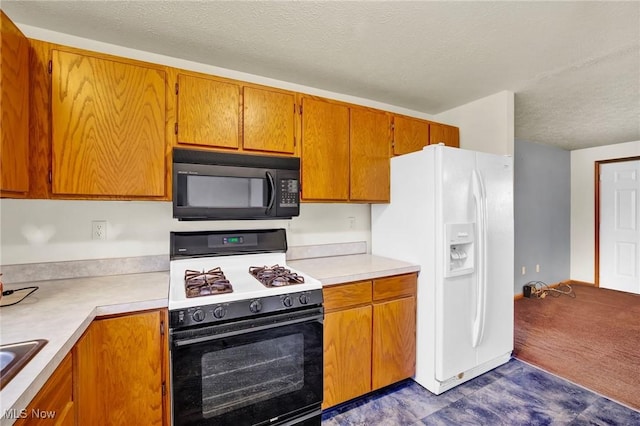 kitchen featuring sink, white appliances, a textured ceiling, and dark colored carpet