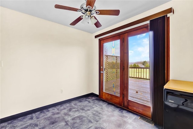 doorway with ceiling fan