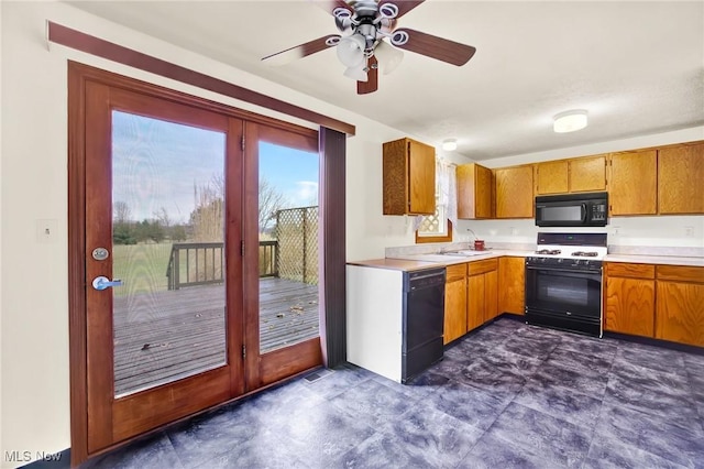 kitchen with sink and black appliances