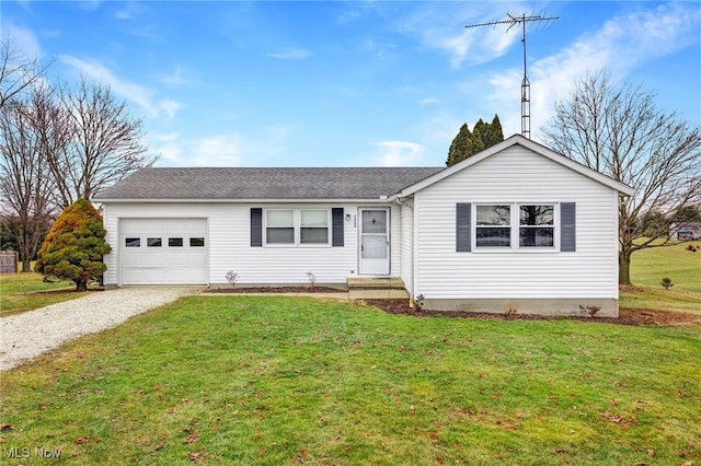 ranch-style house with a garage and a front lawn