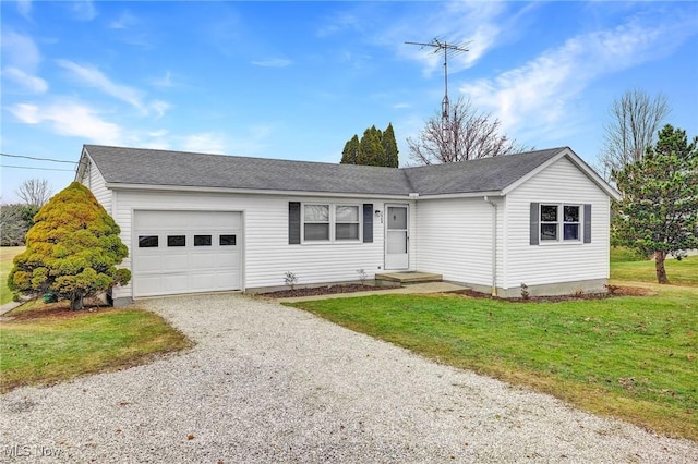 ranch-style home featuring a garage and a front lawn