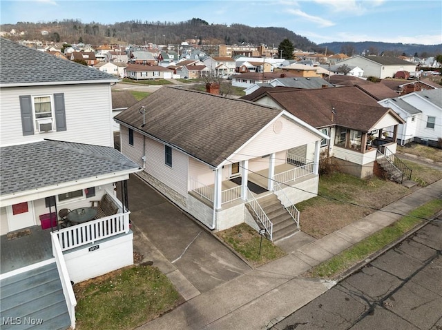 birds eye view of property with a mountain view