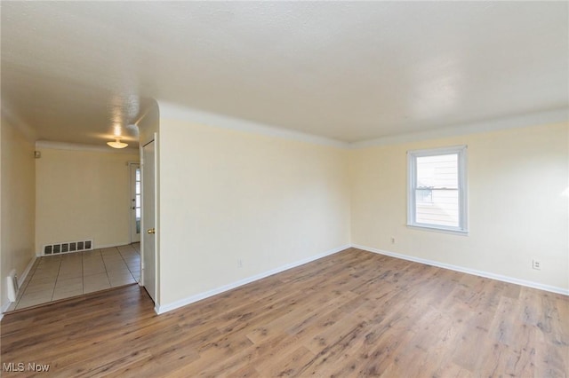 unfurnished room featuring wood-type flooring