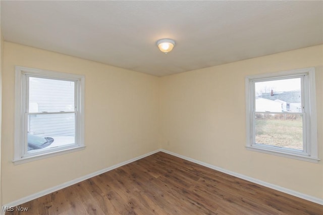 empty room featuring dark wood-type flooring