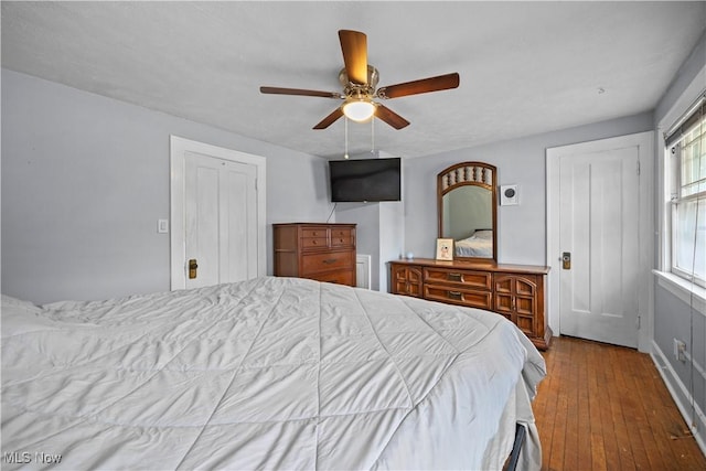 bedroom featuring ceiling fan and wood-type flooring