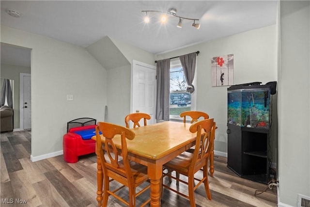 dining room with hardwood / wood-style floors