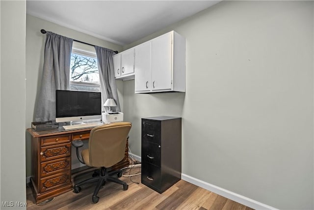 home office with light wood-type flooring