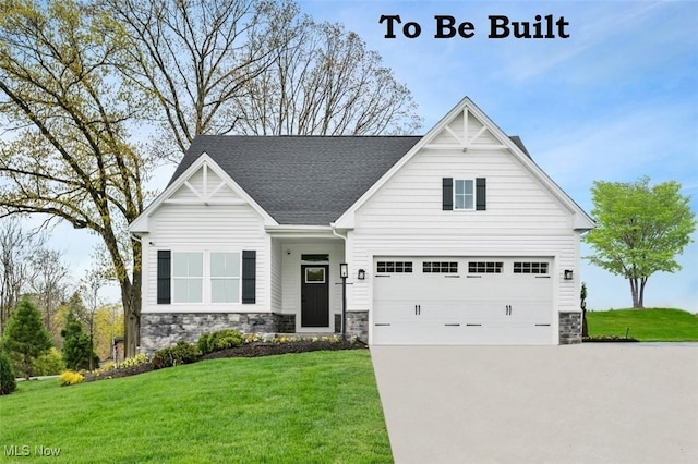 view of front of home featuring a garage and a front yard