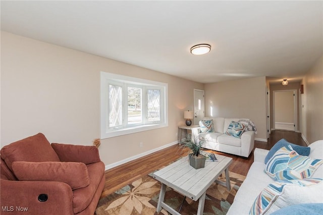 living room featuring dark wood-type flooring