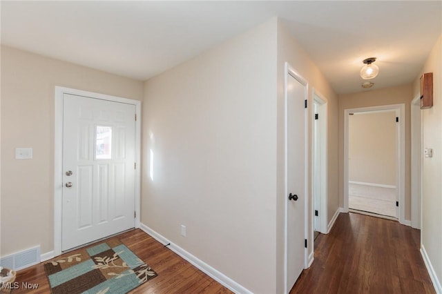 entrance foyer featuring dark wood-type flooring