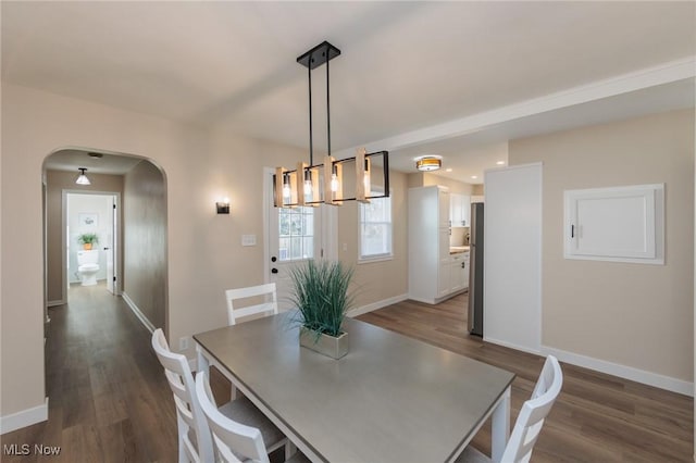 dining space featuring dark hardwood / wood-style floors