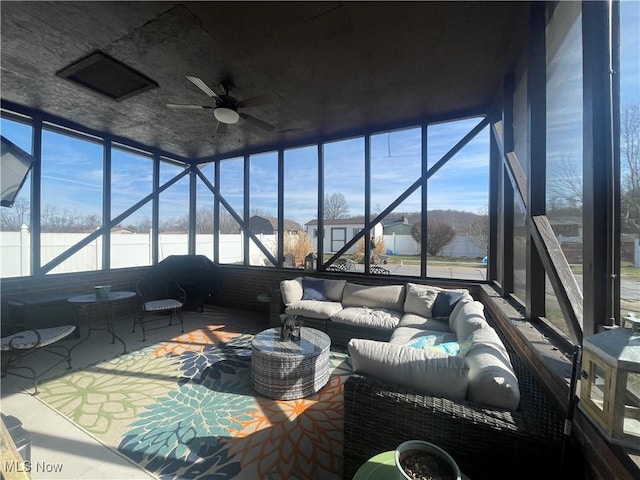 sunroom / solarium with ceiling fan