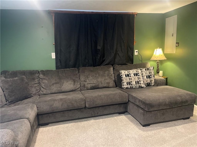 living room with carpet floors and electric panel