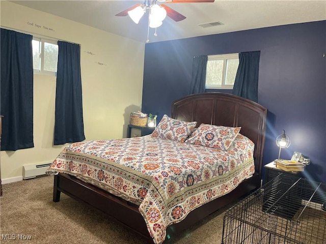 bedroom with ceiling fan, a baseboard radiator, carpet, and multiple windows