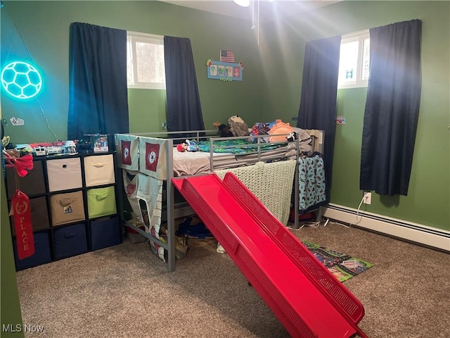 carpeted bedroom with a baseboard radiator