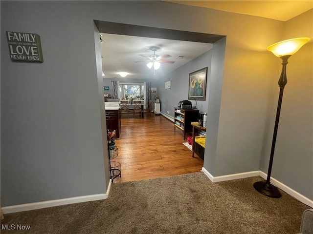 hallway with carpet flooring