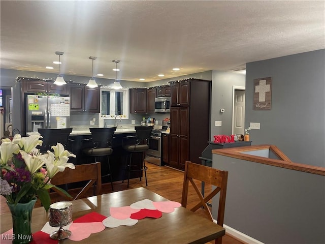 dining room with hardwood / wood-style flooring