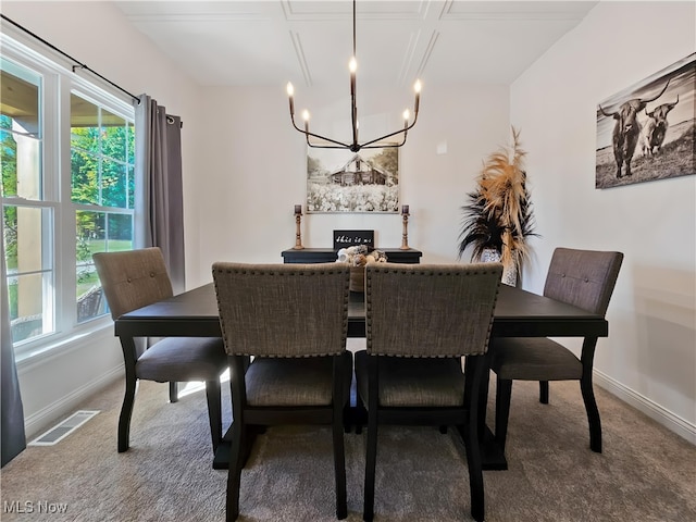 carpeted dining room with a notable chandelier and plenty of natural light