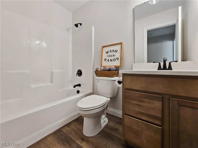 full bathroom with hardwood / wood-style flooring, vanity, toilet, and bathing tub / shower combination