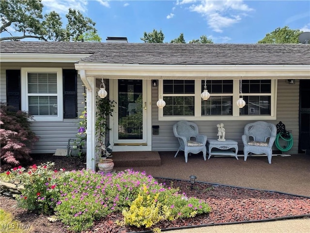 doorway to property featuring covered porch