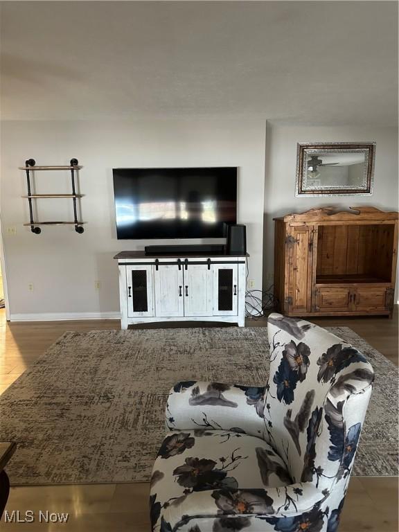 unfurnished living room featuring wood-type flooring