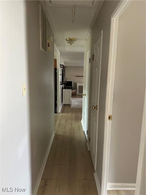 hallway featuring light hardwood / wood-style floors