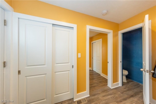 hallway featuring hardwood / wood-style floors