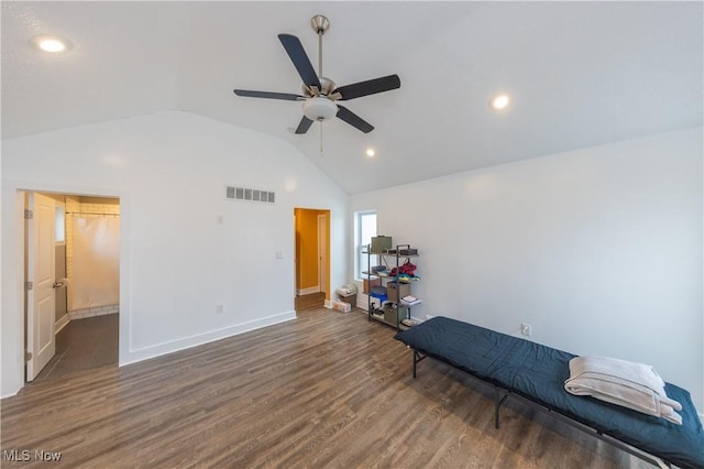 workout room featuring lofted ceiling, dark hardwood / wood-style floors, and ceiling fan