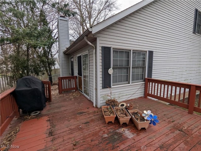 wooden deck with area for grilling