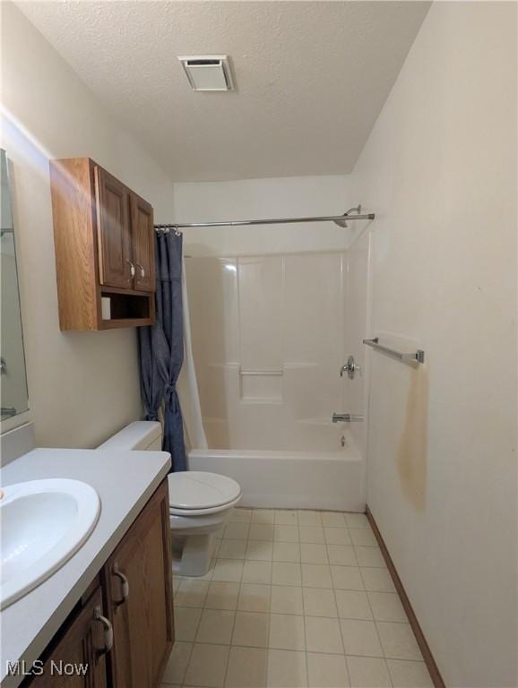 full bathroom featuring vanity, shower / bath combination with curtain, toilet, and a textured ceiling