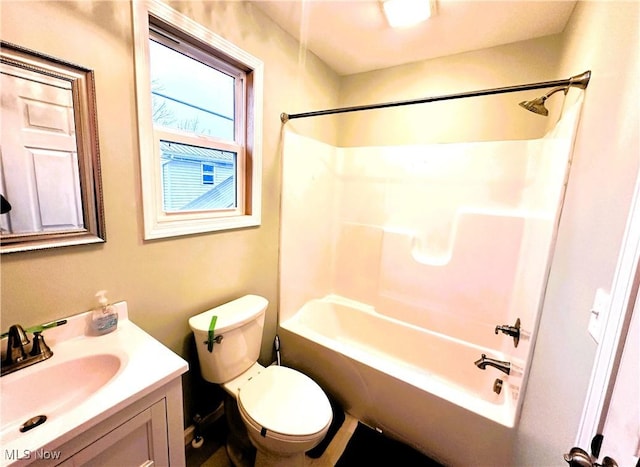 full bathroom with vanity, tub / shower combination, and toilet