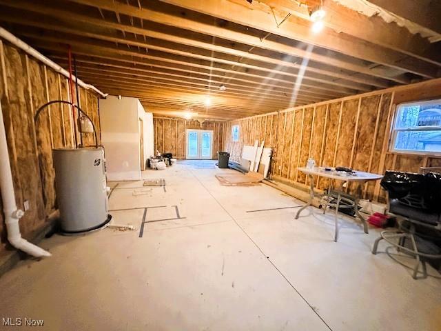 basement featuring electric water heater