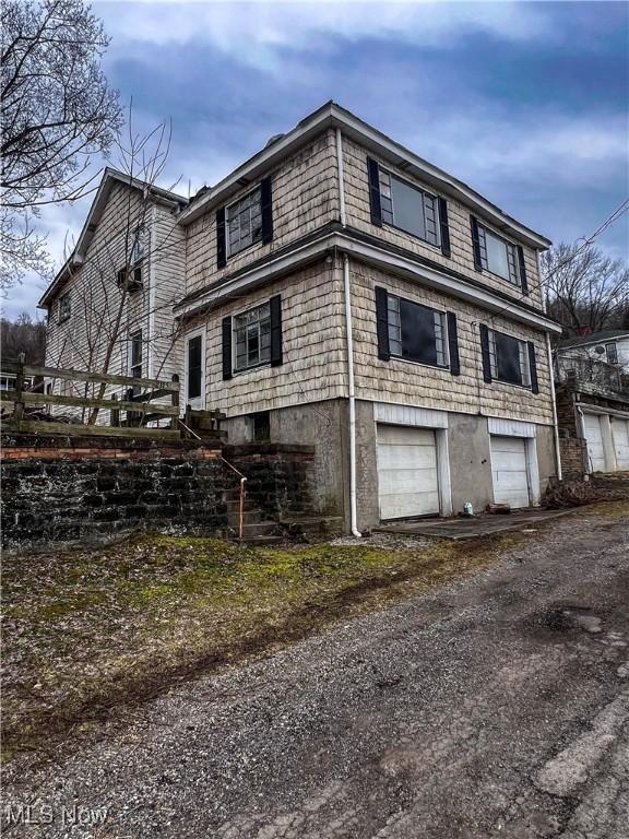 view of property exterior featuring a garage