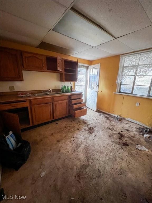 kitchen featuring sink and a paneled ceiling