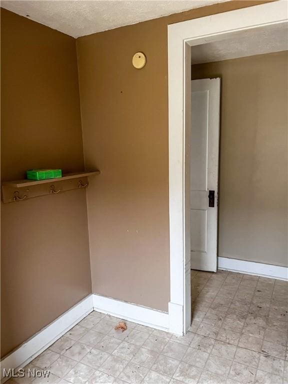 spare room featuring a textured ceiling