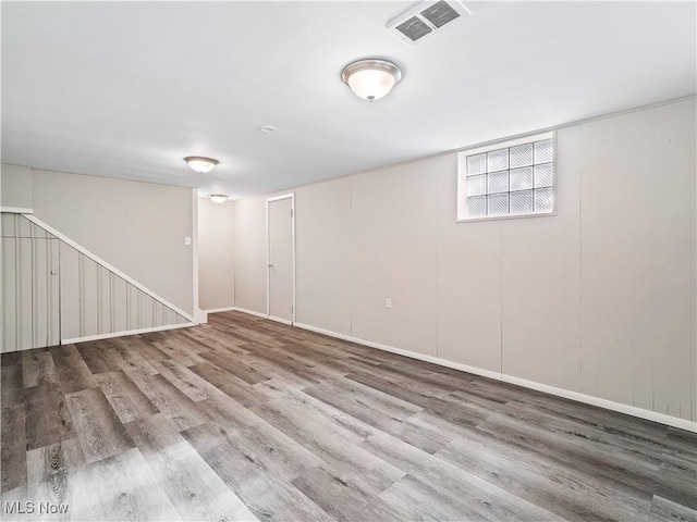 basement with wood-type flooring