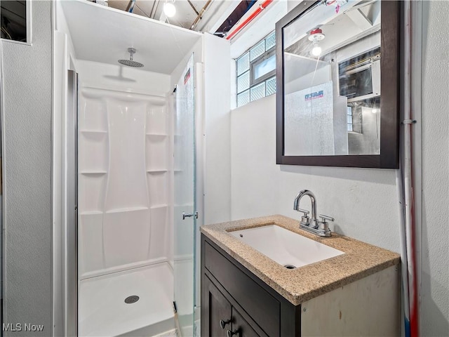 bathroom featuring vanity and walk in shower