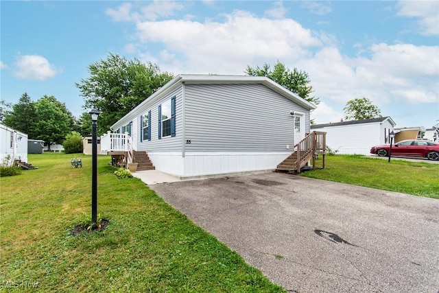 view of side of property featuring a yard