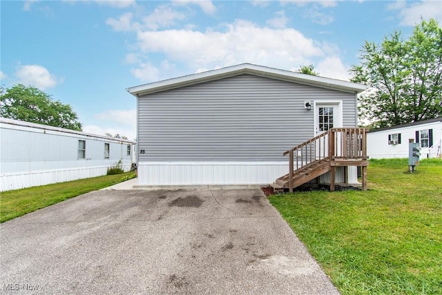 view of property exterior featuring a yard