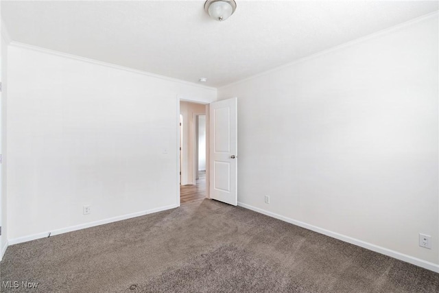 carpeted spare room with ornamental molding