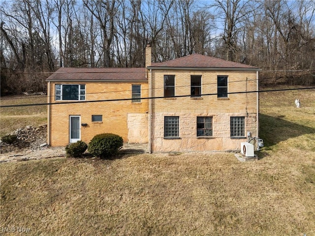 view of property exterior featuring a yard and ac unit