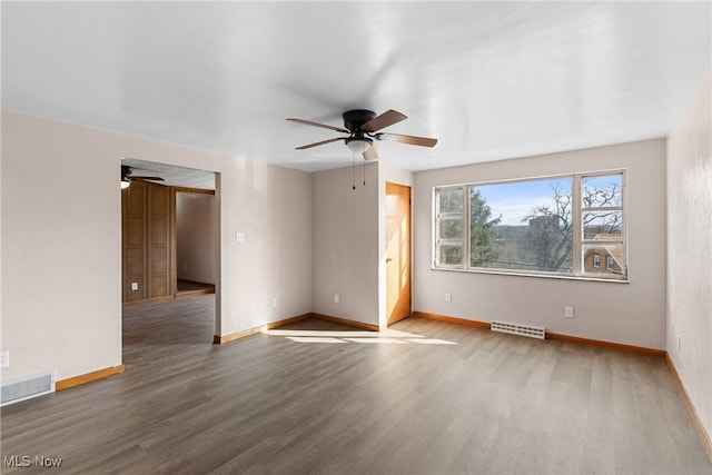 spare room with hardwood / wood-style flooring and ceiling fan