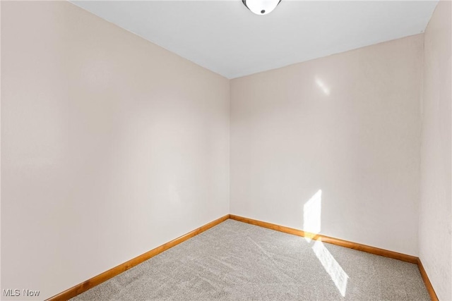 unfurnished room with carpet flooring