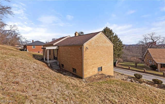 view of home's exterior featuring a lawn