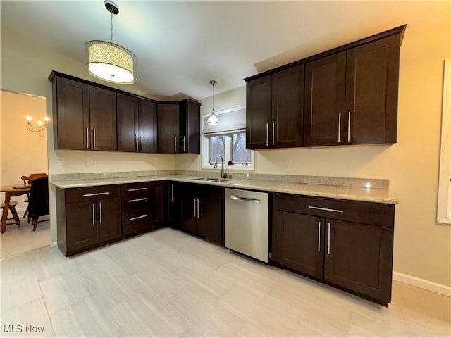 kitchen with stainless steel dishwasher, decorative light fixtures, sink, and dark brown cabinets