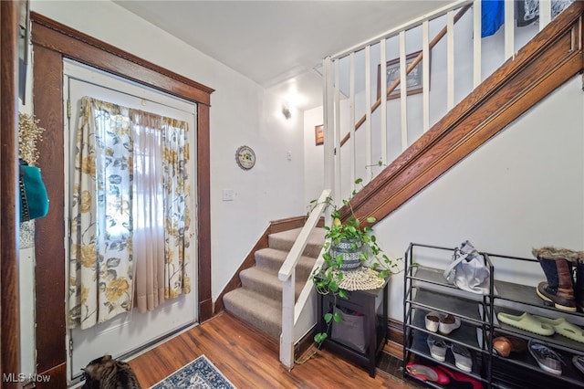 foyer entrance with hardwood / wood-style flooring