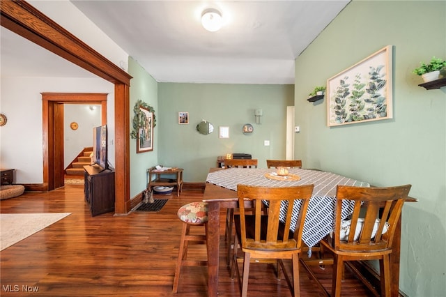 dining space with hardwood / wood-style floors