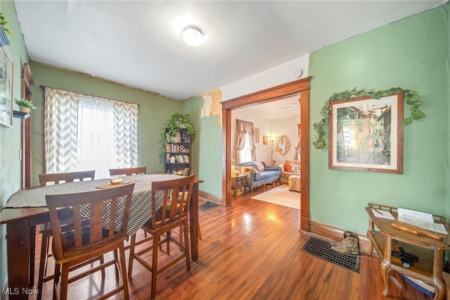 dining room with hardwood / wood-style flooring