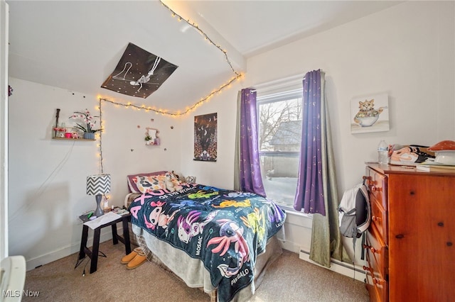 carpeted bedroom with a baseboard heating unit